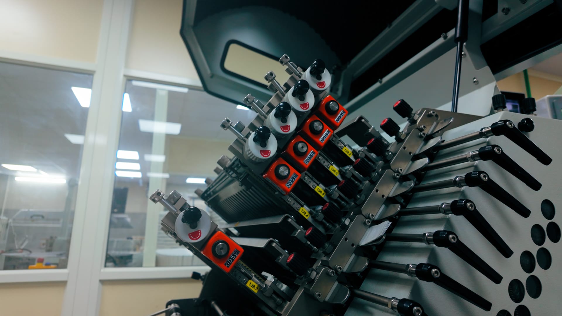 Close-up of a folding machine's precision adjustment mechanism