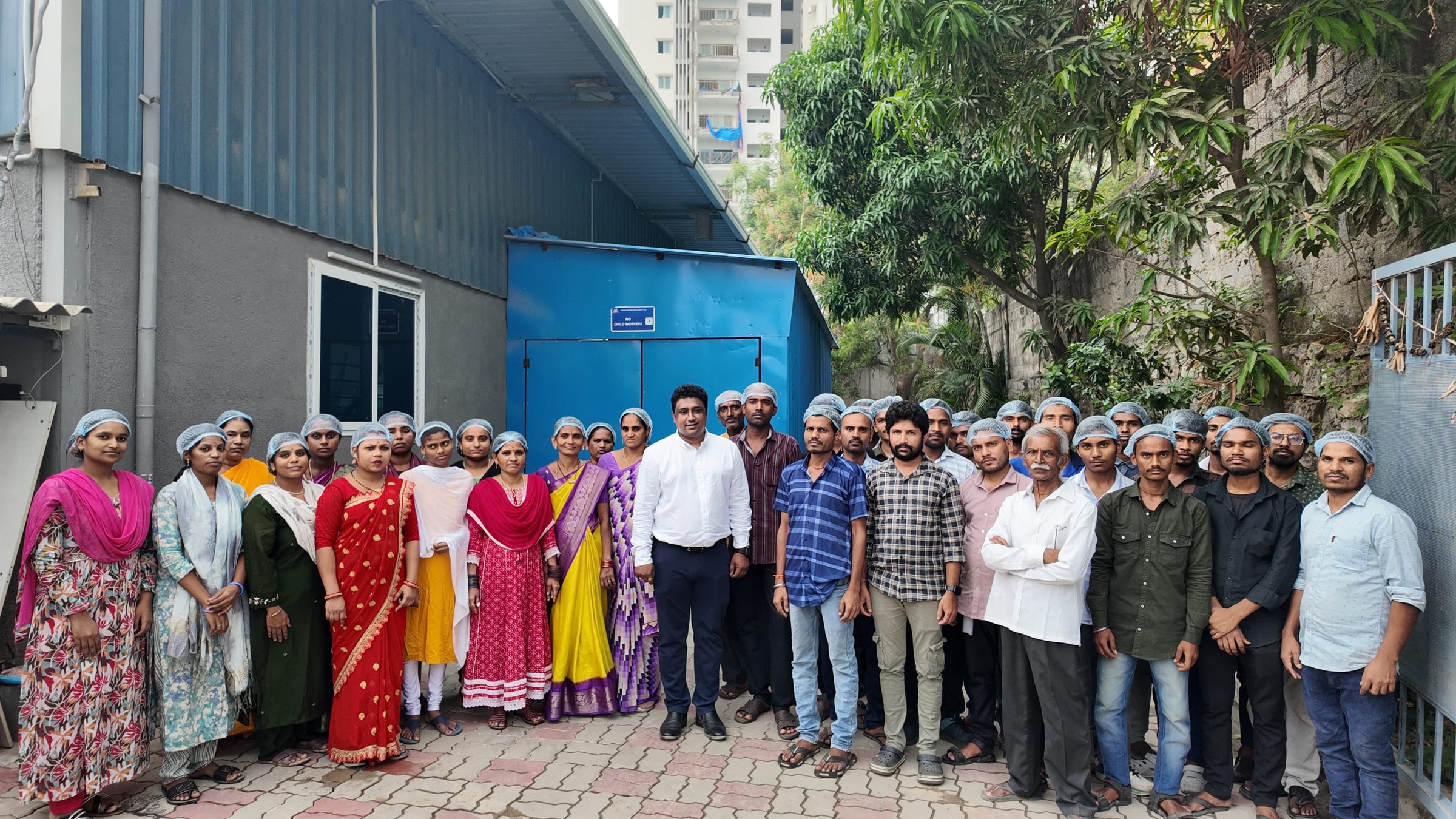 The Mudrika team outside the manufacturing facility in Hyderabad